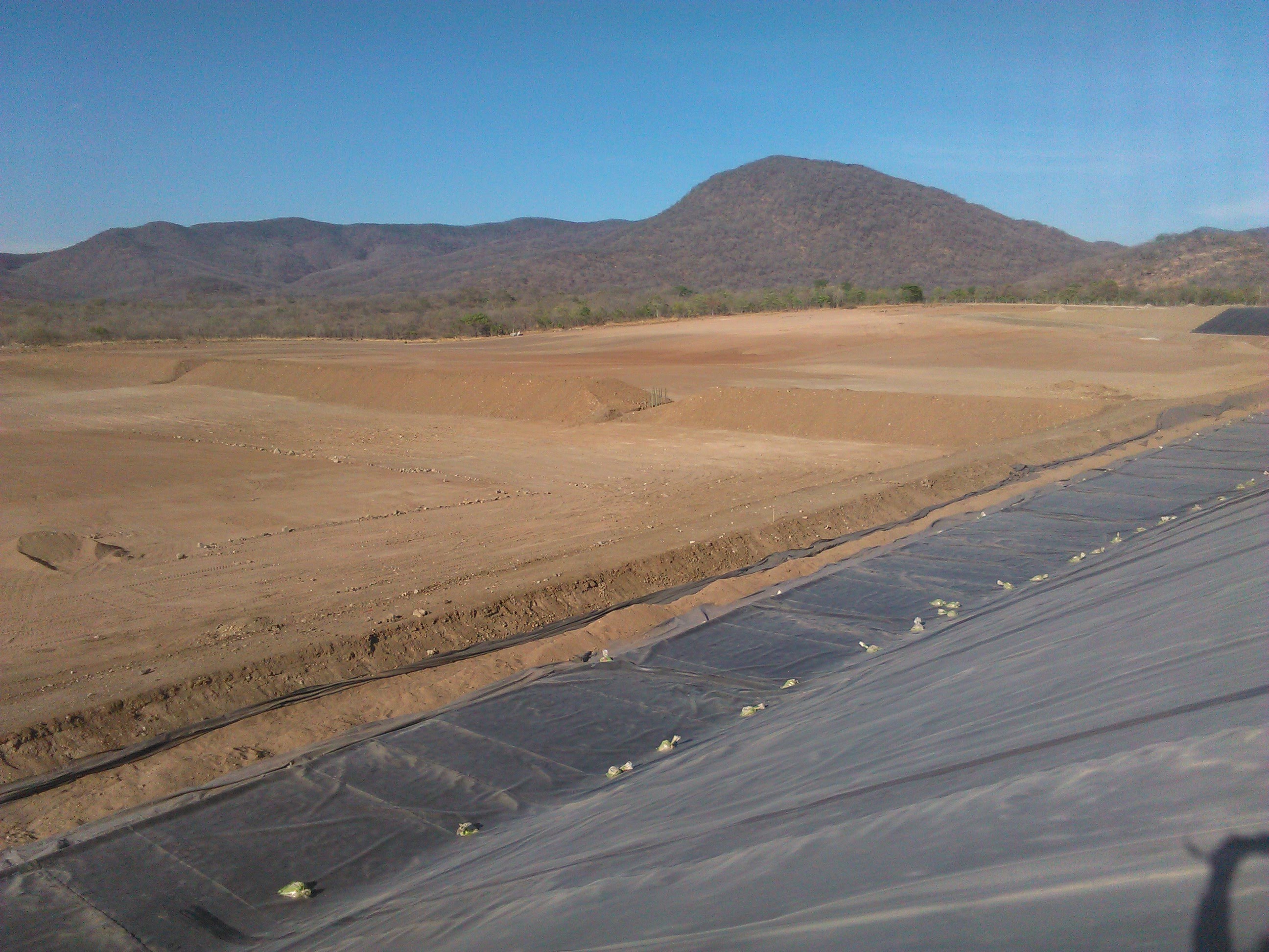 Large HDPE liner installation on mining pond